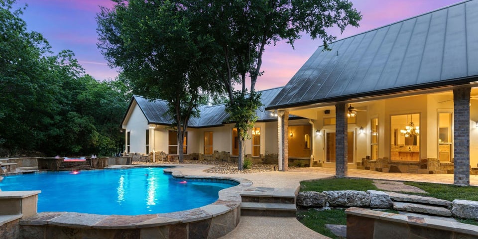 luxury outdoor home addition in austin texas with pool and seating area