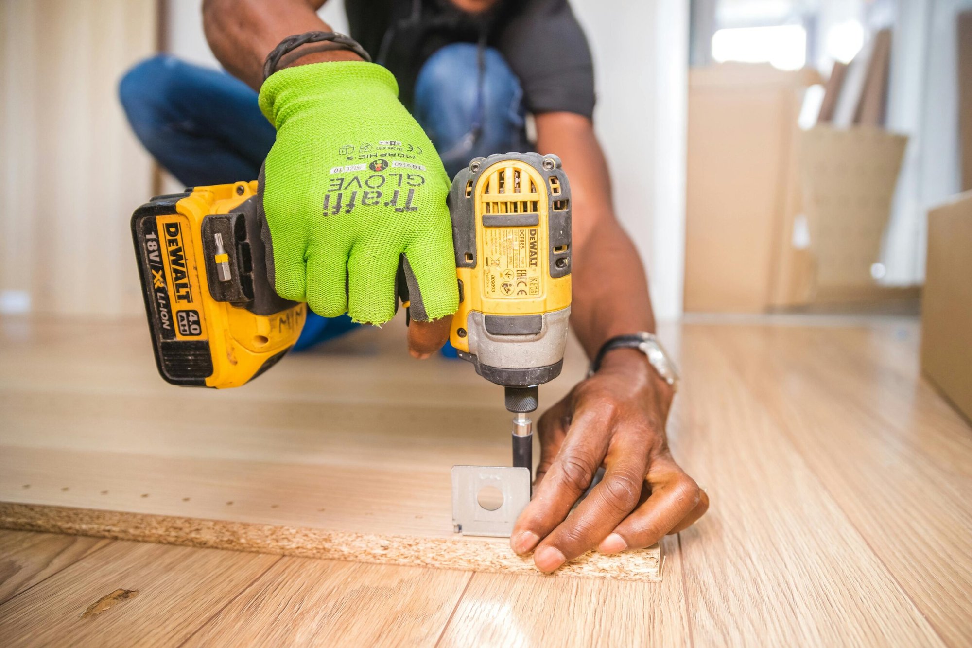 man using DeWalt screwgun in a home remodel project