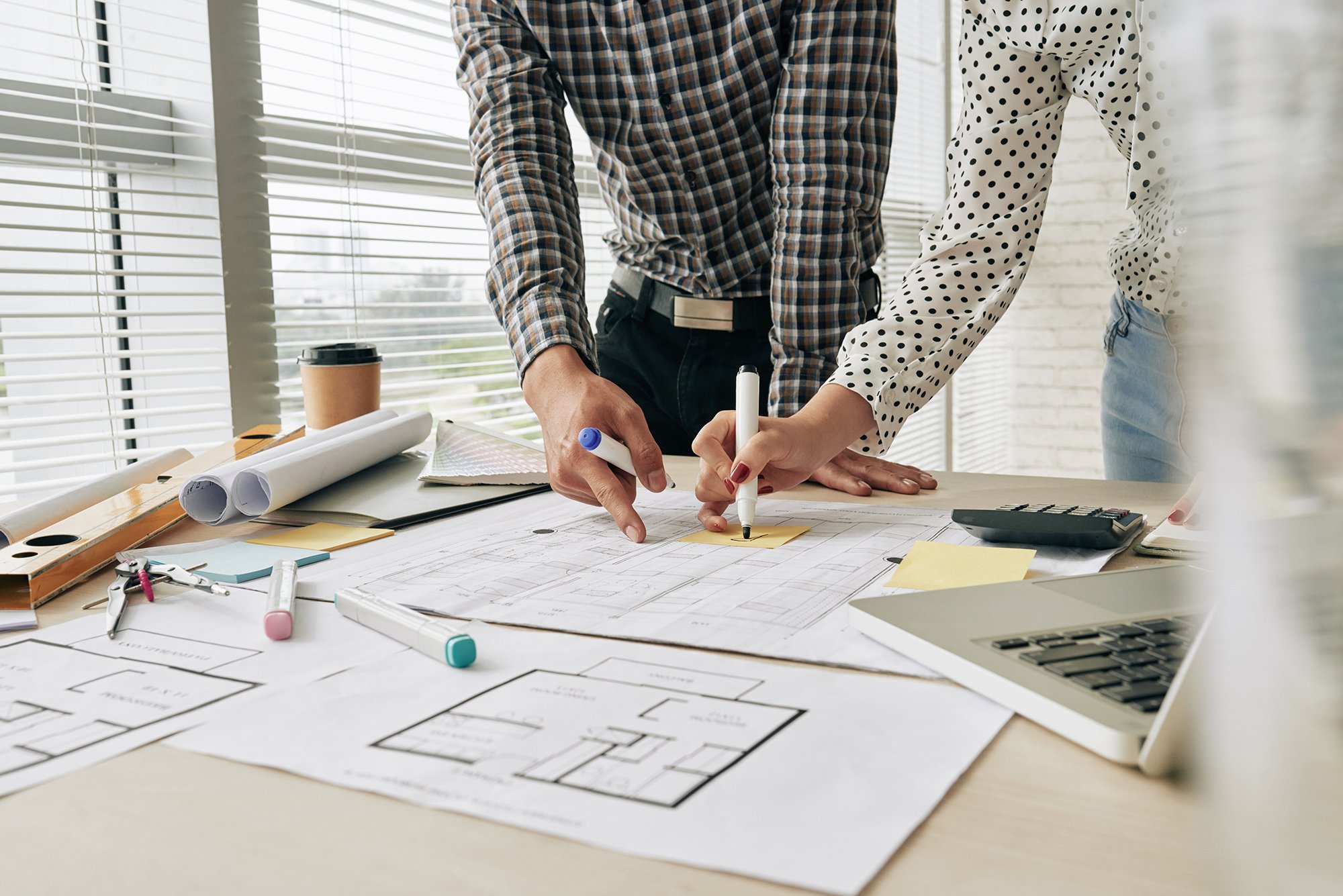 Two People Working on a Blueprint