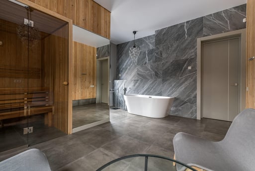 Luxury bathroom remodel by Truelux Fine Homes in Austin, Texas featuring a sauna and freestanding tub